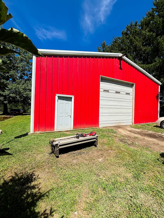 garage featuring a yard