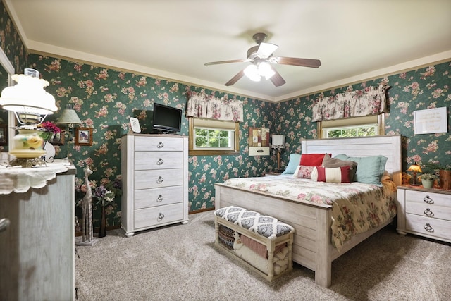 bedroom with carpet floors, ceiling fan, and ornamental molding