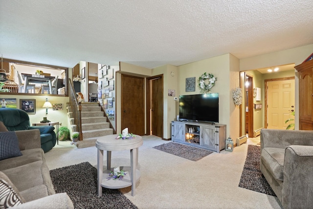 living room featuring a textured ceiling, light colored carpet, and baseboard heating