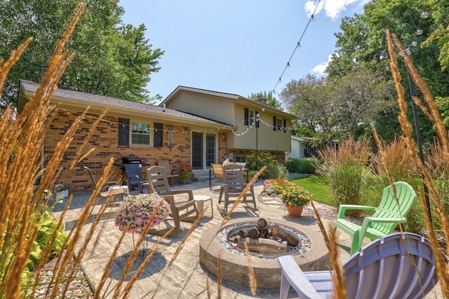 view of patio / terrace with an outdoor fire pit