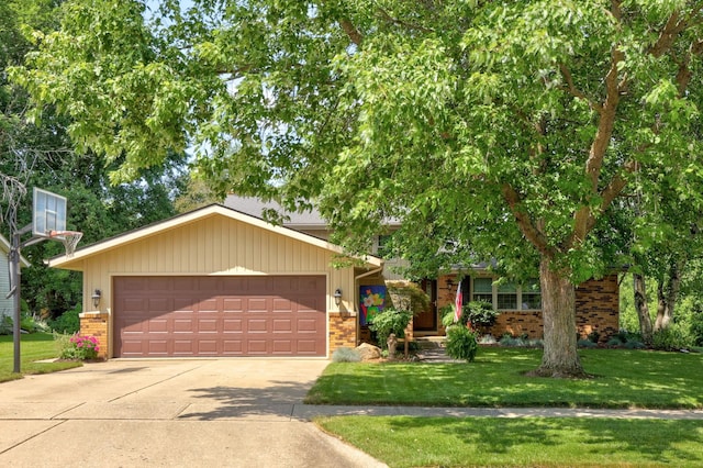 view of front of home with a front lawn and a garage