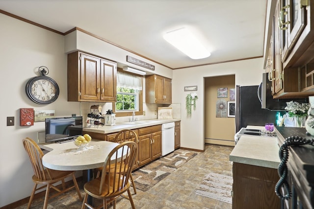 kitchen featuring white dishwasher, a baseboard radiator, crown molding, and sink