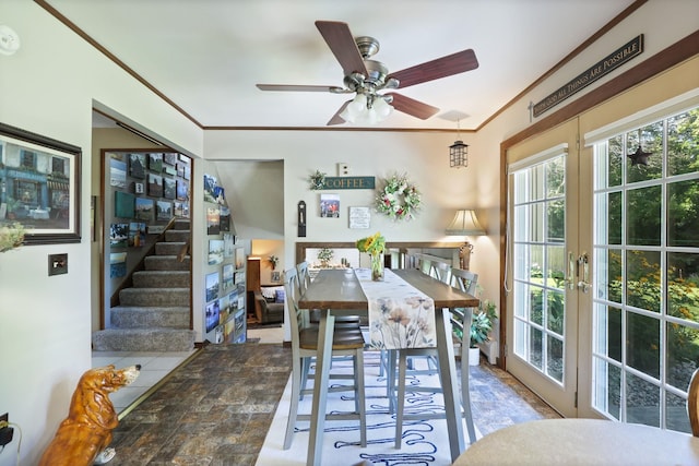 dining area featuring ceiling fan, french doors, and ornamental molding