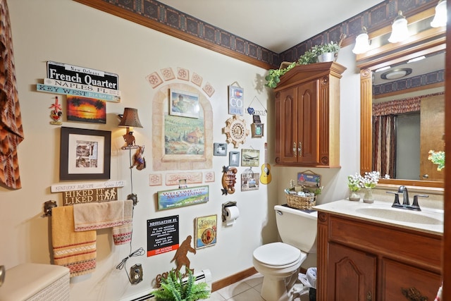 bathroom with tile patterned flooring, vanity, and toilet