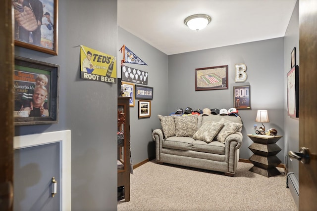 sitting room with carpet flooring and a baseboard radiator