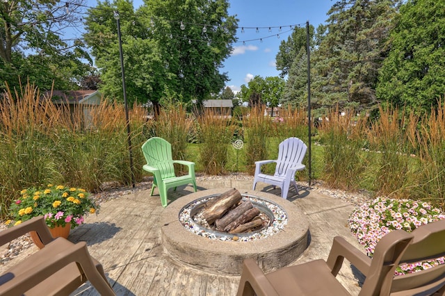 view of patio with an outdoor fire pit