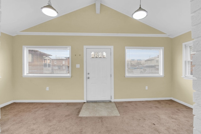 entrance foyer featuring carpet flooring, lofted ceiling with beams, plenty of natural light, and crown molding