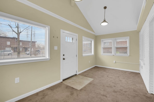 entrance foyer featuring light carpet and lofted ceiling