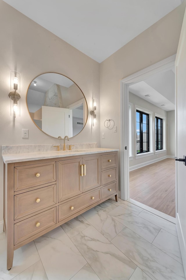 bathroom with hardwood / wood-style floors and vanity