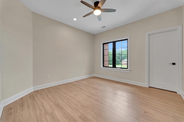 unfurnished room featuring ceiling fan and light wood-type flooring