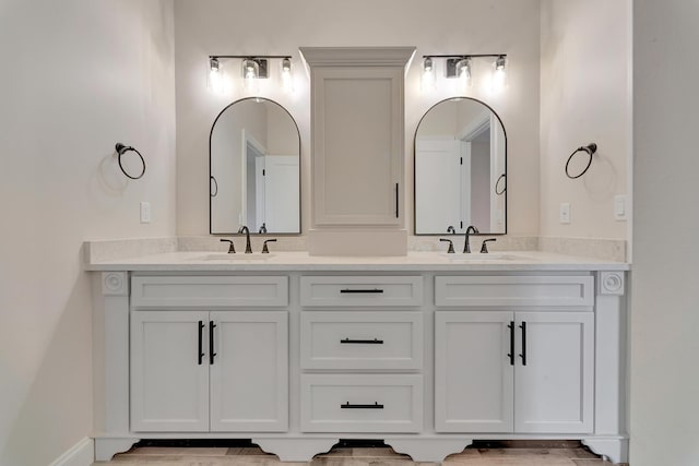 bathroom with hardwood / wood-style flooring and vanity