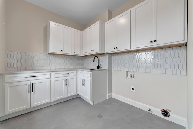 laundry area featuring sink, cabinets, electric dryer hookup, hookup for a washing machine, and light tile patterned floors