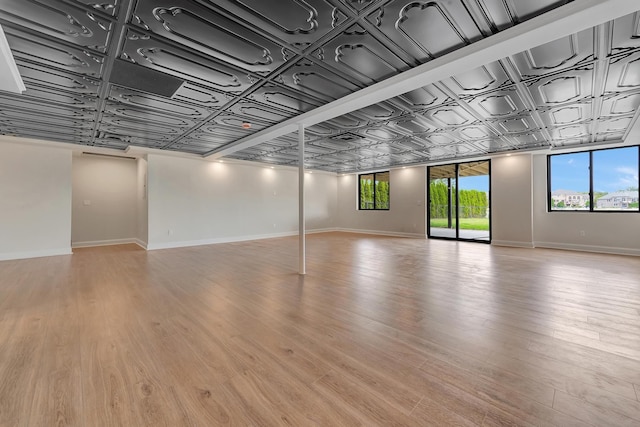 basement featuring light wood-type flooring