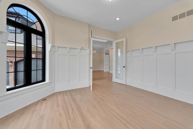 entrance foyer featuring light wood-type flooring and a wealth of natural light