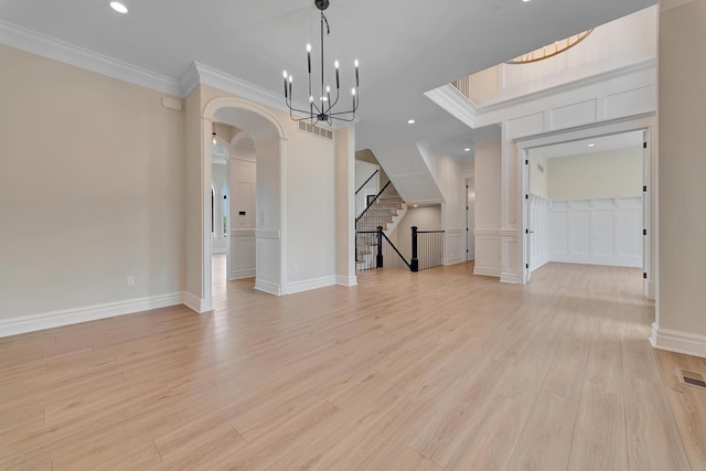 interior space featuring crown molding and light wood-type flooring