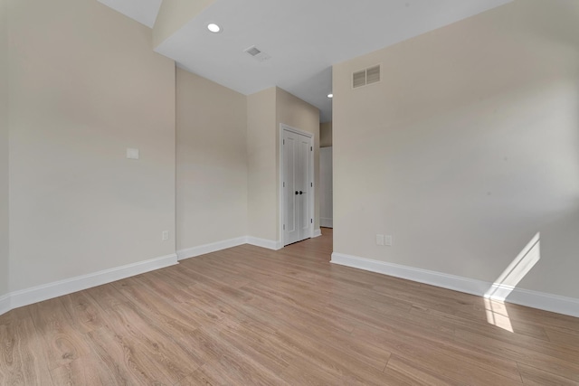 spare room with light hardwood / wood-style floors