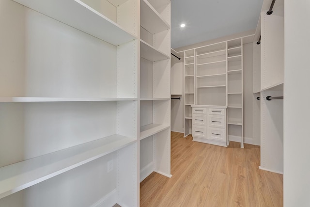 walk in closet featuring hardwood / wood-style flooring