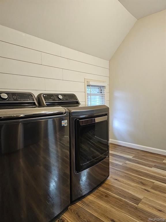 washroom featuring washer and clothes dryer and hardwood / wood-style floors