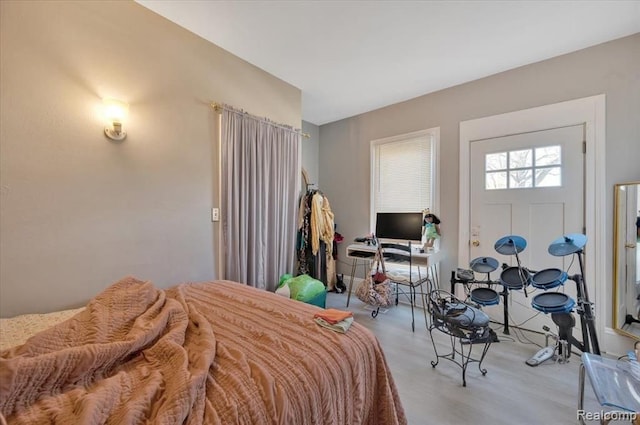 bedroom with light wood-type flooring