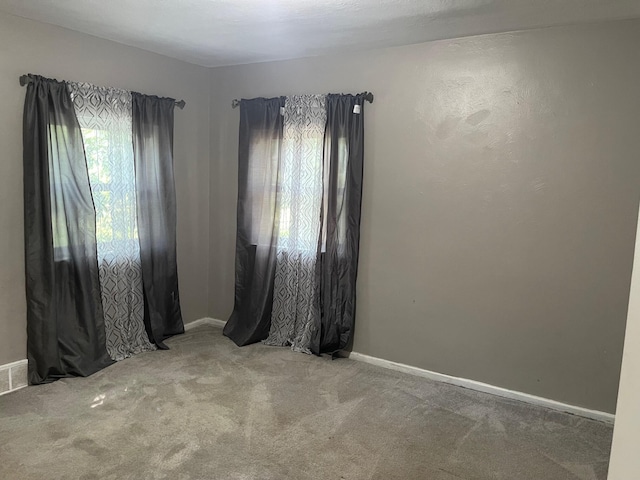 1981 Ray St, Muskegon, MI 49442 - empty room featuring carpet flooring and baseboards