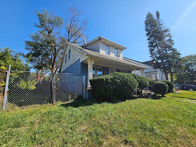 view of side of property with a lawn