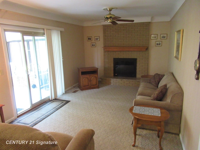 carpeted living room featuring ceiling fan and a fireplace