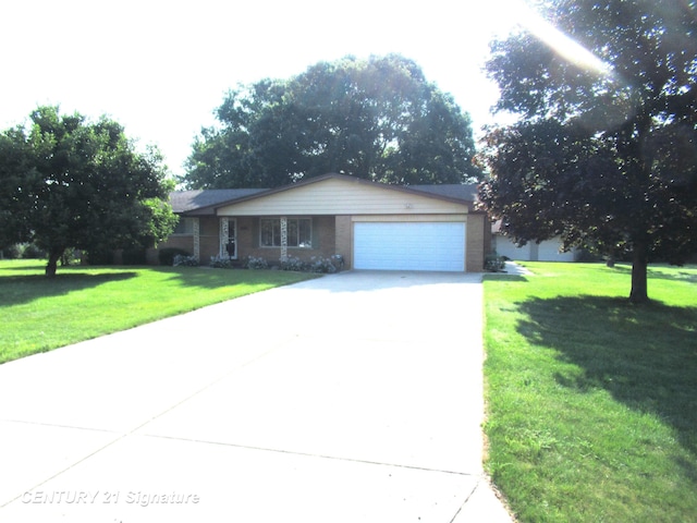 view of front facade with a garage and a front lawn