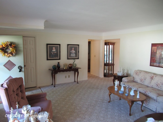 living room featuring light carpet