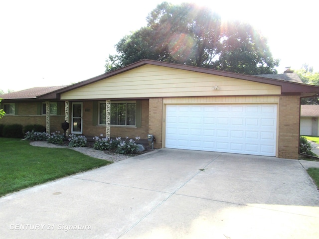 ranch-style home featuring a garage