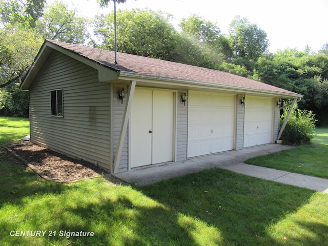 garage with a yard