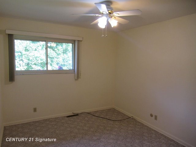 spare room featuring ceiling fan and carpet floors