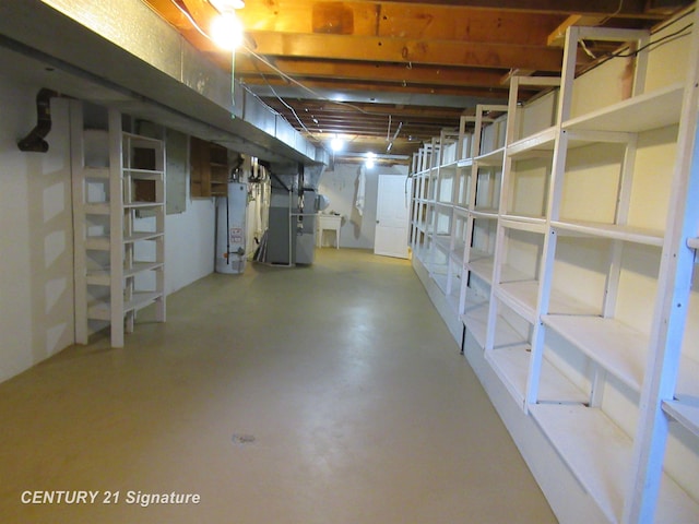 basement featuring heating unit and water heater