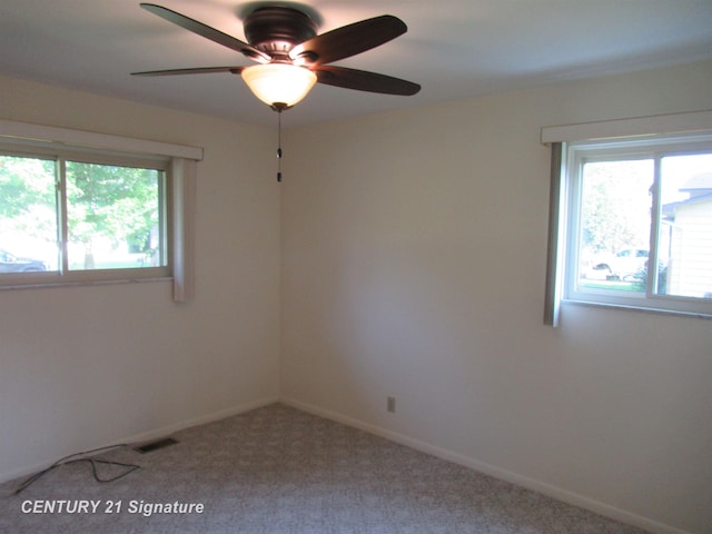 carpeted empty room with ceiling fan