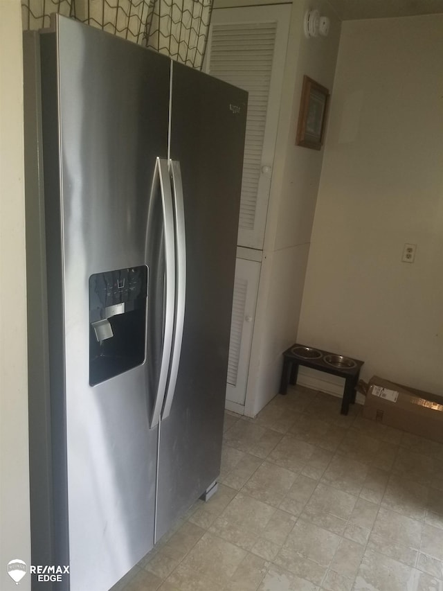 5439 Richfield Rd, Flint, MI 48506 - kitchen featuring stainless steel refrigerator with ice dispenser