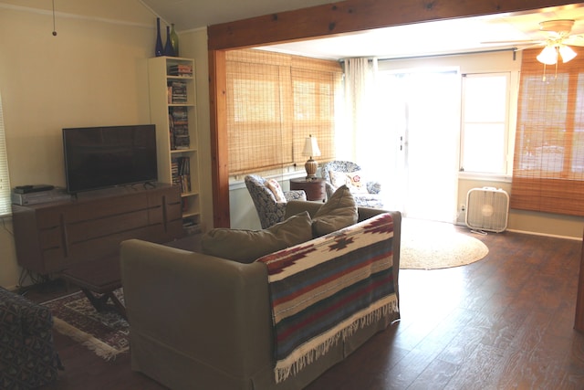 living room featuring dark hardwood / wood-style floors and ceiling fan