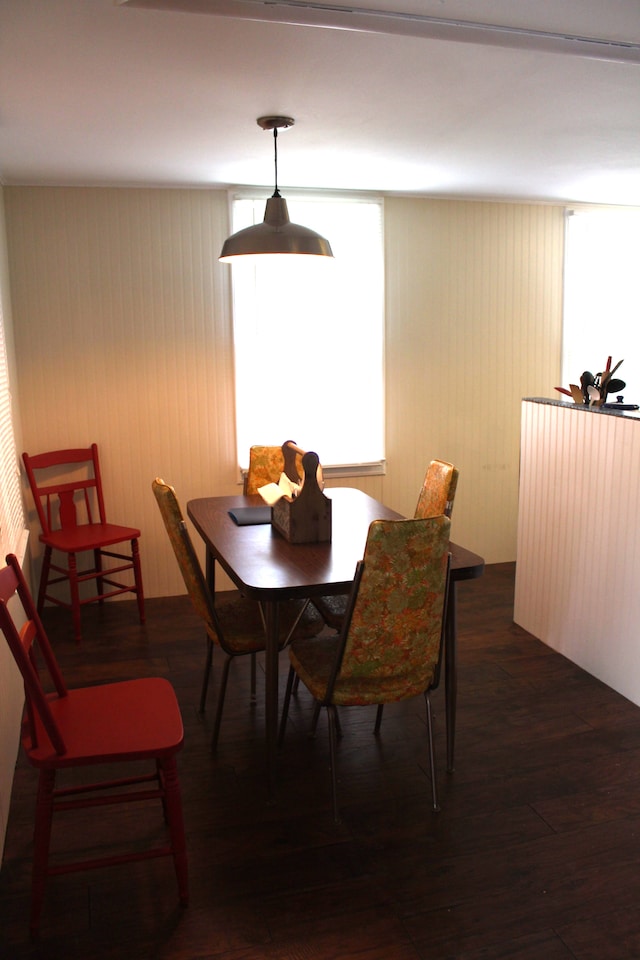 dining room with dark wood-type flooring