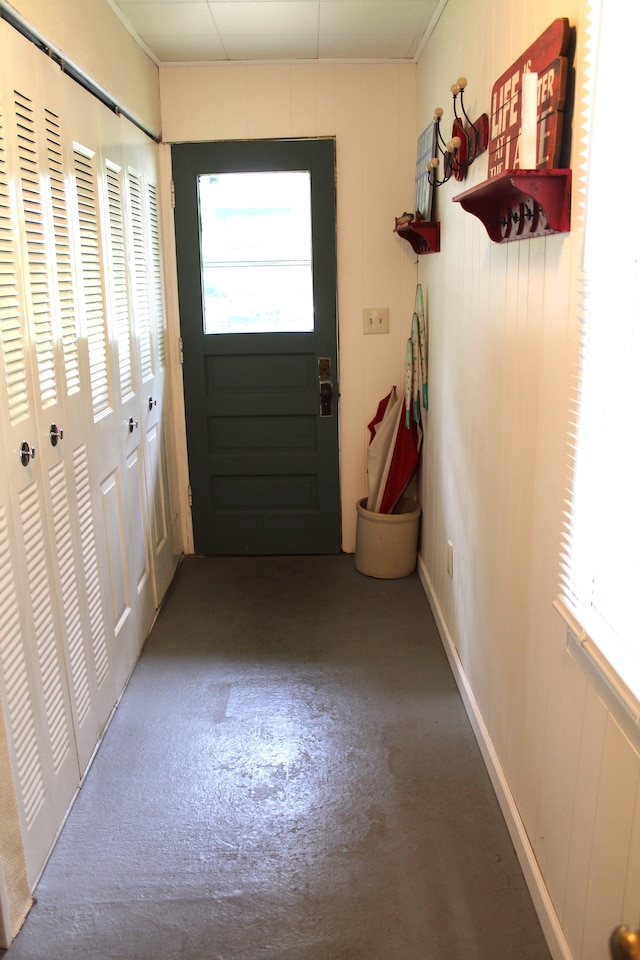 doorway to outside featuring concrete flooring