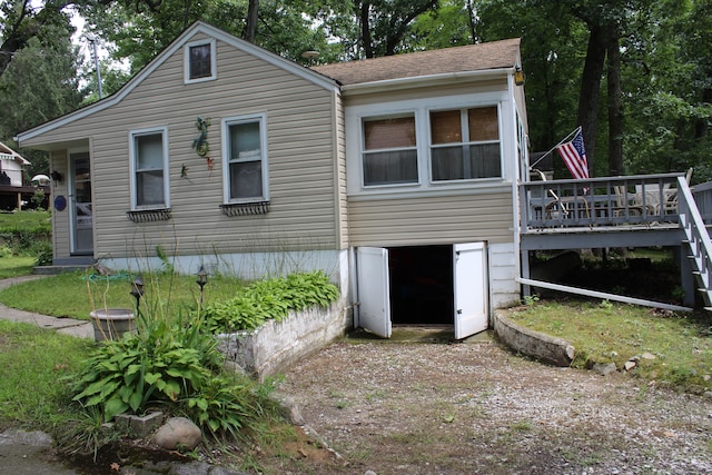 back of property featuring a deck