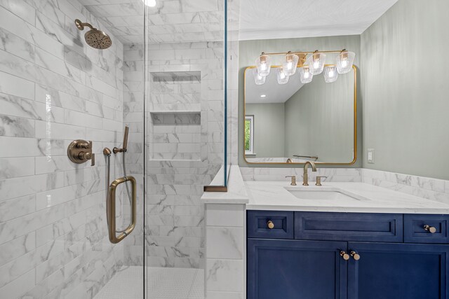 bathroom featuring vanity and an enclosed shower