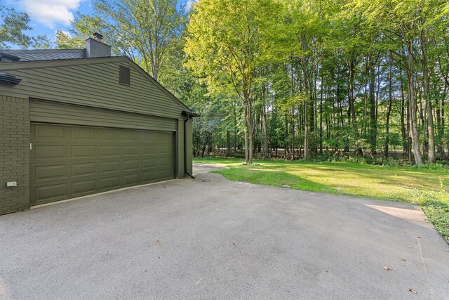 garage with a lawn