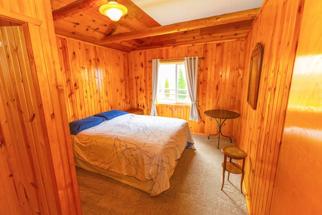 carpeted bedroom featuring beamed ceiling, wooden walls, and wood ceiling