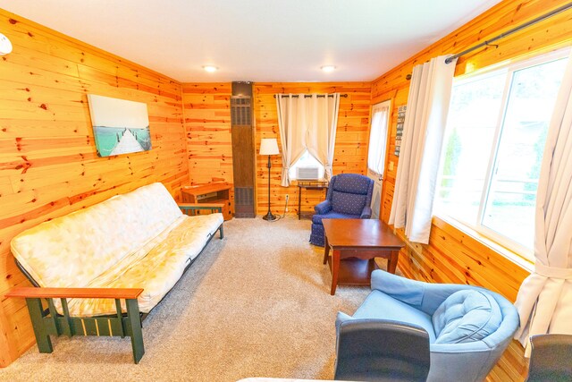 1130 W Higgins Lake Dr, Roscommon, MI 48653 - living area featuring healthy amount of natural light, wooden walls, carpet flooring, and recessed lighting