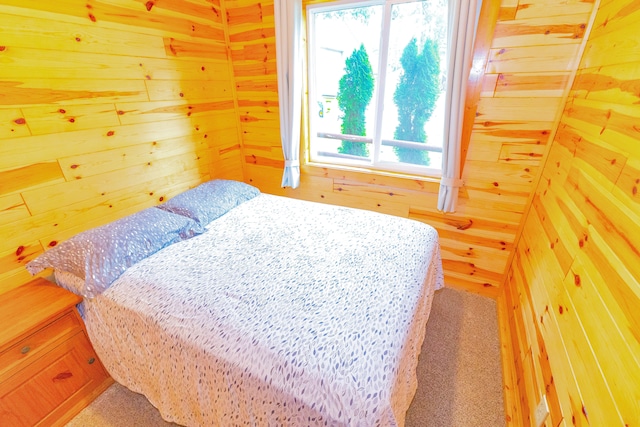 bedroom with wood walls