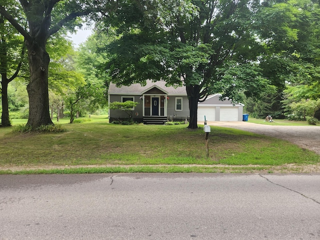 view of front facade featuring a front yard and a garage