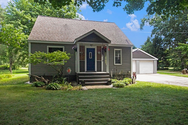 bungalow-style house with a garage and a front lawn