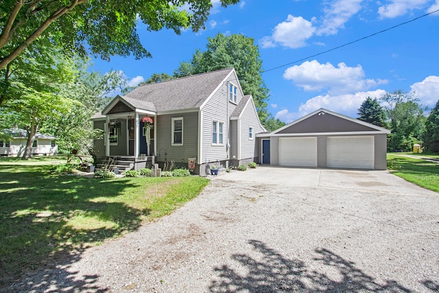 view of front of property with a garage and a front yard