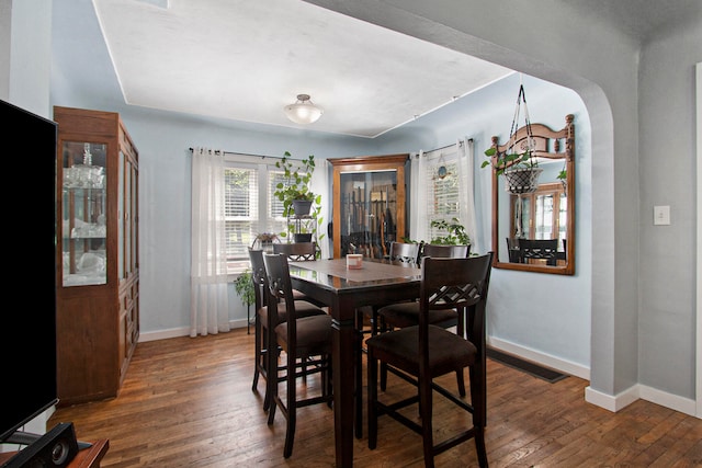 dining room featuring dark hardwood / wood-style flooring