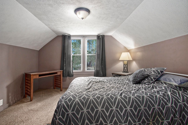 bedroom with carpet flooring, lofted ceiling, and a textured ceiling