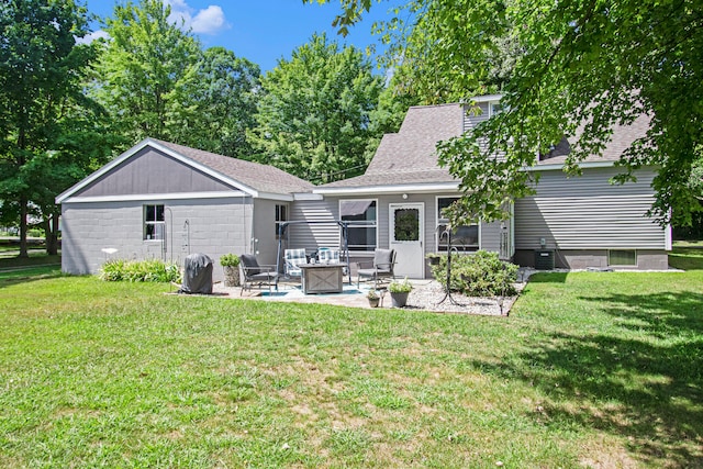 back of property featuring central air condition unit, a patio area, a yard, and an outdoor hangout area