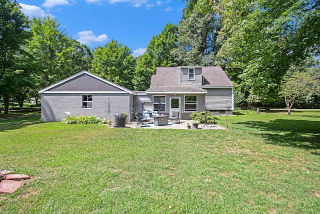 rear view of house featuring a fire pit, a patio area, and a lawn